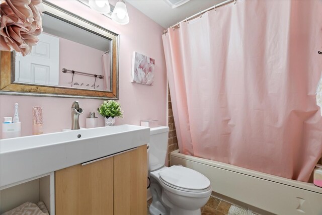 47 Pier Dr Unit 102, Westmont, IL 60559 - full bathroom featuring toilet, vanity, and shower / tub combo