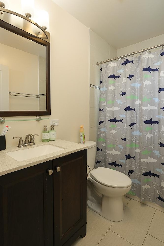 401 N Humphrey Ave, Oak Park, IL 60302 - full bathroom featuring vanity, tile patterned floors, and a shower with shower curtain