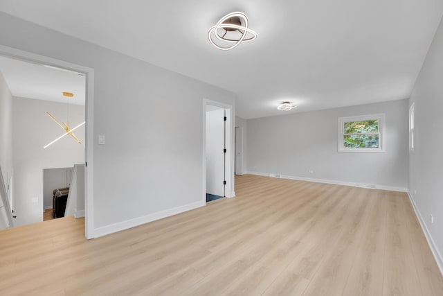 18624 W Pamela Pl, Gurnee, IL 60031 - spare room with light wood-type flooring and baseboards