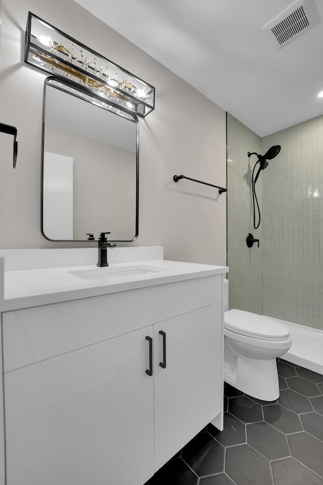 18624 W Pamela Pl, Gurnee, IL 60031 - bathroom with vanity, a tile shower, and tile patterned flooring