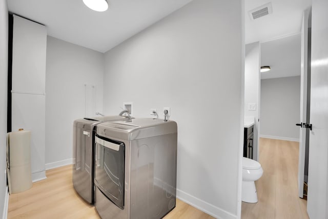 18624 W Pamela Pl, Gurnee, IL 60031 - laundry room featuring separate washer and dryer and light wood-style floors