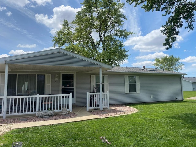 101 Crescent Dr, Watseka, IL 60970 - back of property with a lawn, a porch, and roof with shingles