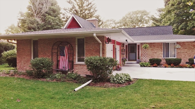 42W490 Kedeka Rd, Sugar Grove, IL 60554 - view of front of house with brick siding, a front lawn, a shingled roof, and a chimney