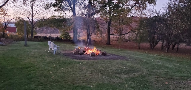 42W490 Kedeka Rd, Sugar Grove, IL 60554 - view of green lawn featuring an outdoor fire pit