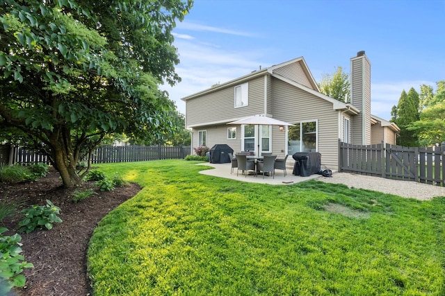 2003 Schumacher Dr, Naperville, IL 60540 - back of property with a chimney, a patio, and a fenced backyard