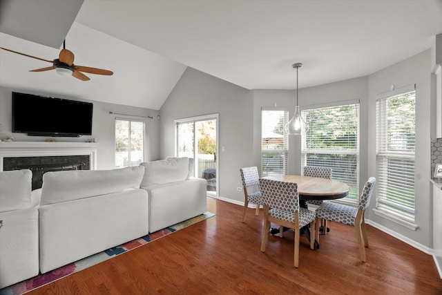2003 Schumacher Dr, Naperville, IL 60540 - dining room featuring a ceiling fan, wood finished floors, plenty of natural light, a fireplace, and vaulted ceiling