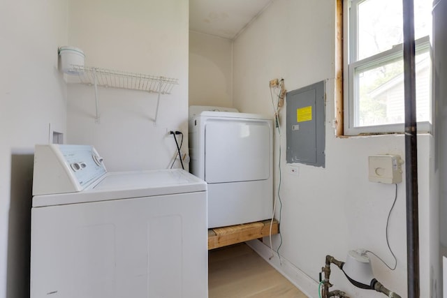 91 Rockledge Dr, Romeoville, IL 60446 - washroom with washing machine and clothes dryer, electric panel, and light wood-type flooring