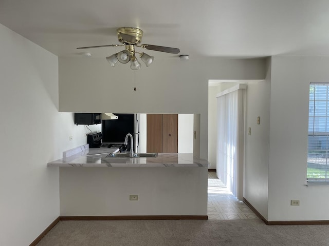 1744 Eastwood Ct Unit 3, Schaumburg, IL 60195 - kitchen with a sink, a ceiling fan, a peninsula, freestanding refrigerator, and baseboards