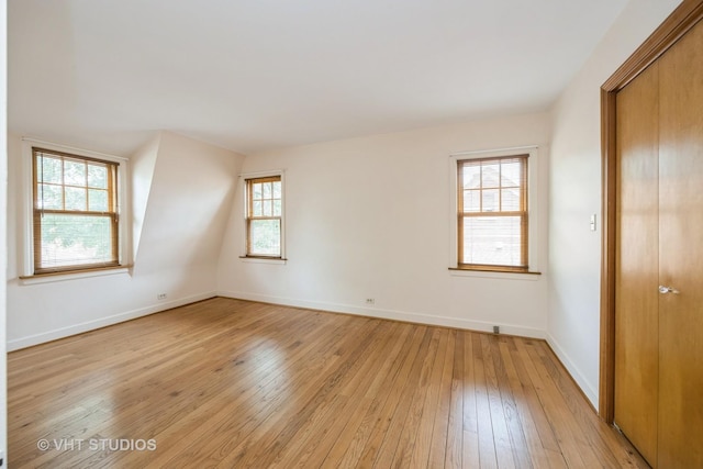 1707 N 78th Ave, Elmwood Park, IL 60707 - unfurnished bedroom with light wood finished floors and a closet