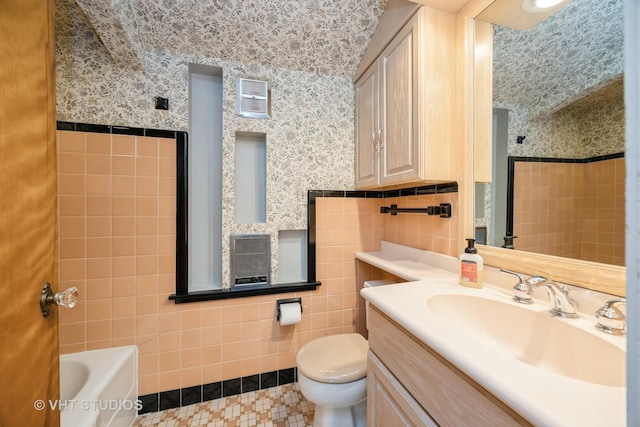 1707 N 78th Ave, Elmwood Park, IL 60707 - bathroom featuring tile walls, vanity, and wallpapered walls