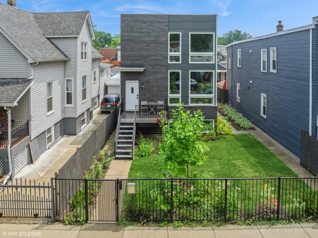 1633 N Saint Louis Ave, Chicago, IL 60647 - back of property featuring a deck, stairway, and a gate