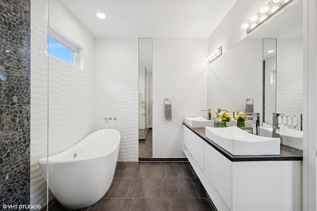 1633 N Saint Louis Ave, Chicago, IL 60647 - full bathroom featuring double vanity, a soaking tub, and tile patterned flooring