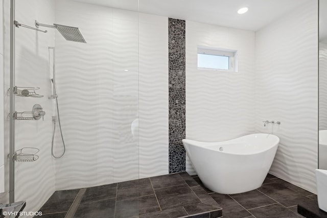 1633 N Saint Louis Ave, Chicago, IL 60647 - bathroom with a freestanding bath, an enclosed shower, and tile patterned floors