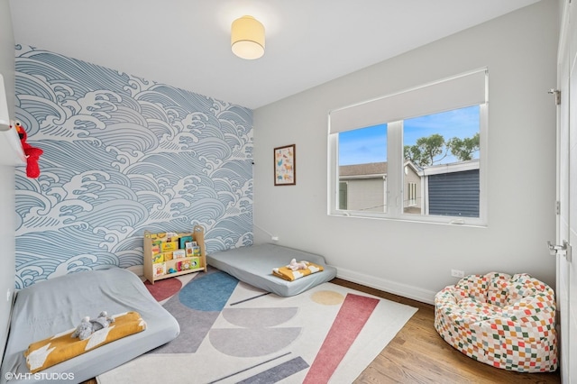 1633 N Saint Louis Ave, Chicago, IL 60647 - playroom with wood finished floors and baseboards