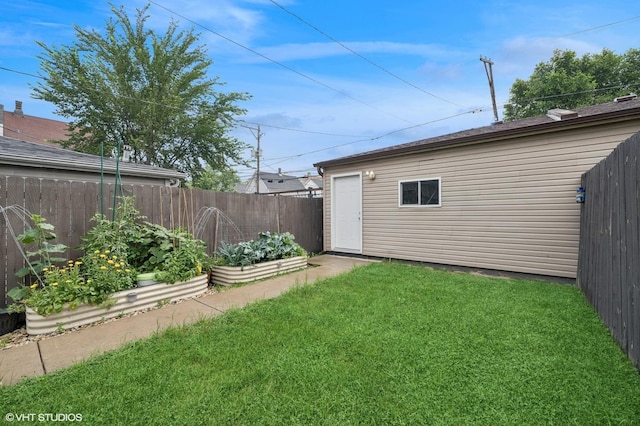 1633 N Saint Louis Ave, Chicago, IL 60647 - view of yard with a vegetable garden and an outdoor structure