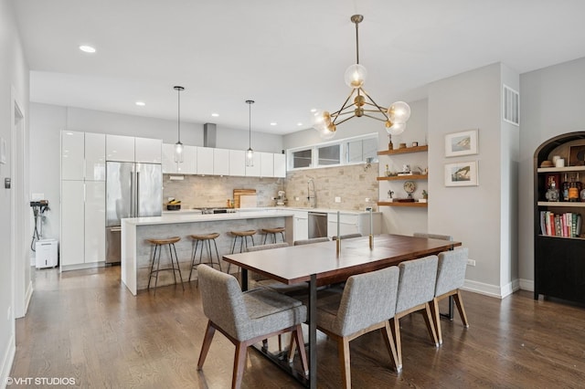 1633 N Saint Louis Ave, Chicago, IL 60647 - dining room with dark wood-style floors, recessed lighting, and a chandelier
