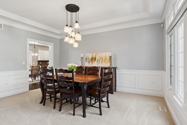 3136 Kewanee Ln, Naperville, IL 60564 - dining area featuring light colored carpet, wainscoting, a chandelier, and ornamental molding