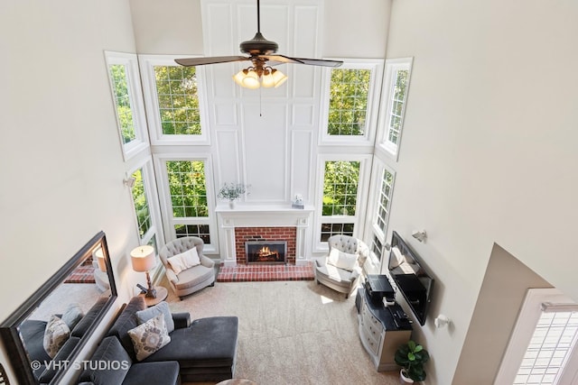 3136 Kewanee Ln, Naperville, IL 60564 - living area with a high ceiling, a ceiling fan, a fireplace, and healthy amount of natural light