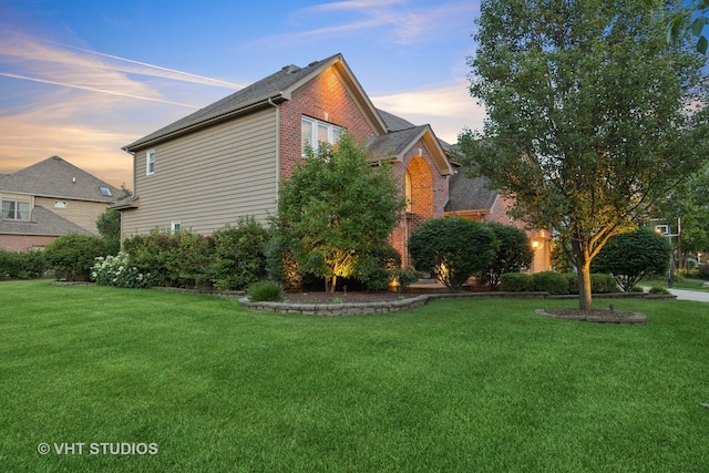 3136 Kewanee Ln, Naperville, IL 60564 - property exterior at dusk featuring a lawn and brick siding