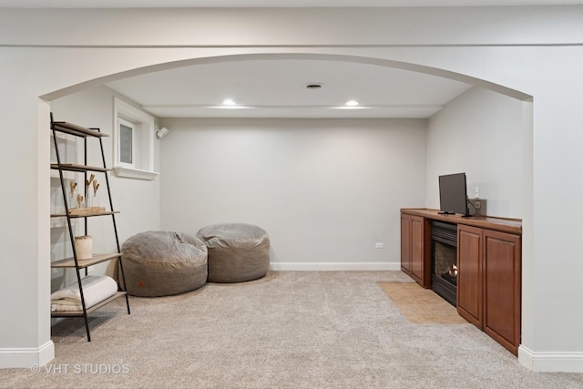 3136 Kewanee Ln, Naperville, IL 60564 - living area featuring light carpet, recessed lighting, arched walkways, and a fireplace with flush hearth