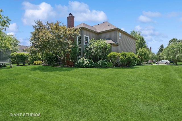 3136 Kewanee Ln, Naperville, IL 60564 - view of grassy yard with a trampoline