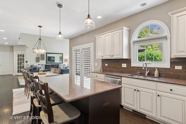 3136 Kewanee Ln, Naperville, IL 60564 - kitchen with stone counters, backsplash, open floor plan, pendant lighting, and dark wood-type flooring