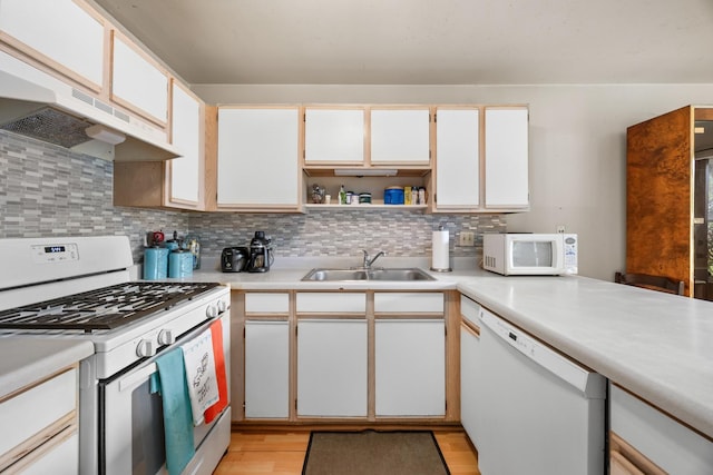 1022 Chaucer Ct Unit B, Elgin, IL 60120 - kitchen with white appliances, under cabinet range hood, and light countertops