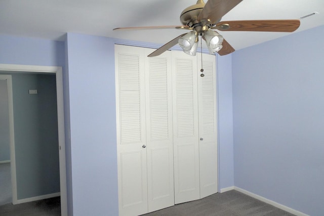 521 Coventry Ln Unit 16, Crystal Lake, IL 60014 - unfurnished bedroom featuring dark carpet, a closet, baseboards, and a ceiling fan