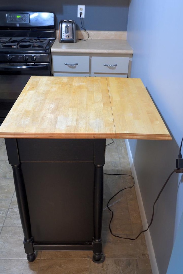 521 Coventry Ln Unit 16, Crystal Lake, IL 60014 - detailed view of butcher block counters and gas stove