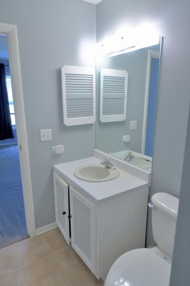 521 Coventry Ln Unit 16, Crystal Lake, IL 60014 - bathroom featuring vanity, toilet, and tile patterned floors