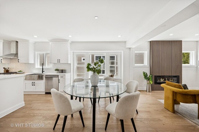 920 Hayes Ave, Oak Park, IL 60302 - dining room featuring recessed lighting, light wood finished floors, and a glass covered fireplace