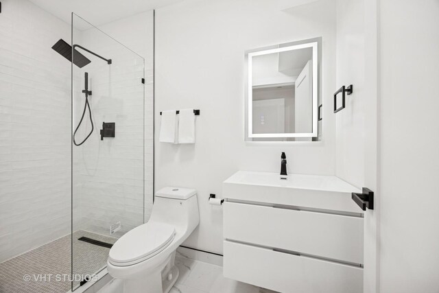 920 Hayes Ave, Oak Park, IL 60302 - bathroom featuring vanity, a tile shower, and marble finish floors