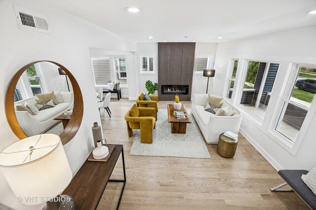 920 Hayes Ave, Oak Park, IL 60302 - living room with wood finished floors, recessed lighting, and a large fireplace
