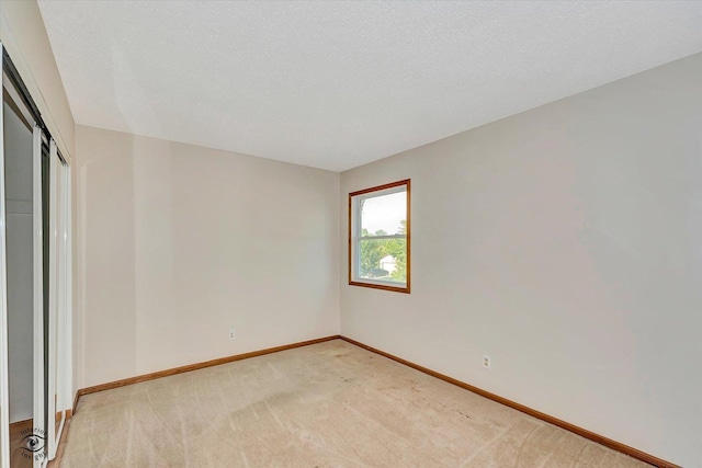 13706 W Cedarbend Dr, Homer Glen, IL 60491 - unfurnished bedroom with light colored carpet and a closet