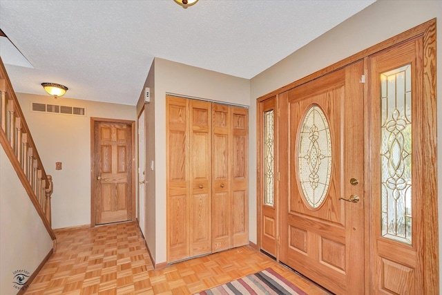 13706 W Cedarbend Dr, Homer Glen, IL 60491 - foyer entrance featuring stairs and a textured ceiling