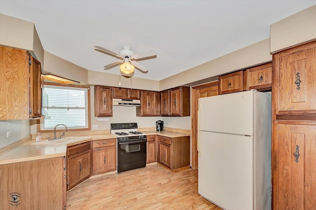 13706 W Cedarbend Dr, Homer Glen, IL 60491 - kitchen featuring freestanding refrigerator, range with gas cooktop, under cabinet range hood, a ceiling fan, and light countertops