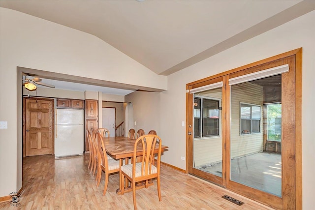 13706 W Cedarbend Dr, Homer Glen, IL 60491 - dining area featuring lofted ceiling, light wood-type flooring, arched walkways, and a ceiling fan