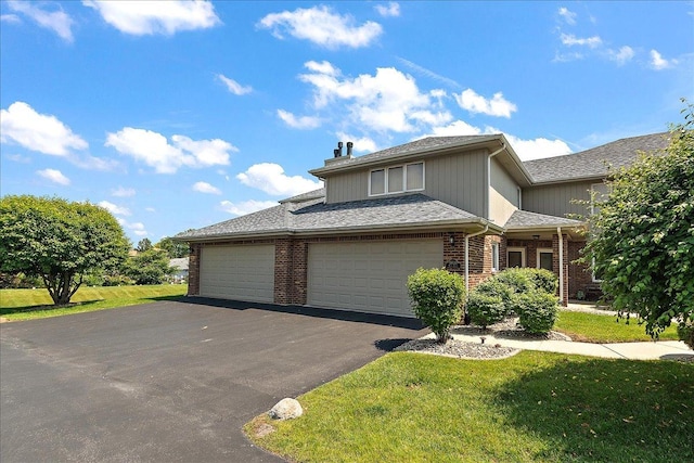 15031 Mayo Dr Unit 19D, Orland Park, IL 60462 - traditional-style house featuring asphalt driveway, a front yard, brick siding, a chimney, and an attached garage