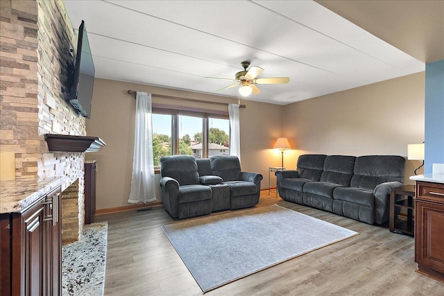 15031 Mayo Dr Unit 19D, Orland Park, IL 60462 - living area with ceiling fan, light wood-style floors, and baseboards