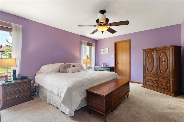 15031 Mayo Dr Unit 19D, Orland Park, IL 60462 - bedroom featuring multiple windows, light colored carpet, and a ceiling fan