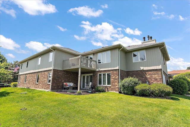 15031 Mayo Dr Unit 19D, Orland Park, IL 60462 - back of house featuring brick siding, a lawn, and a patio