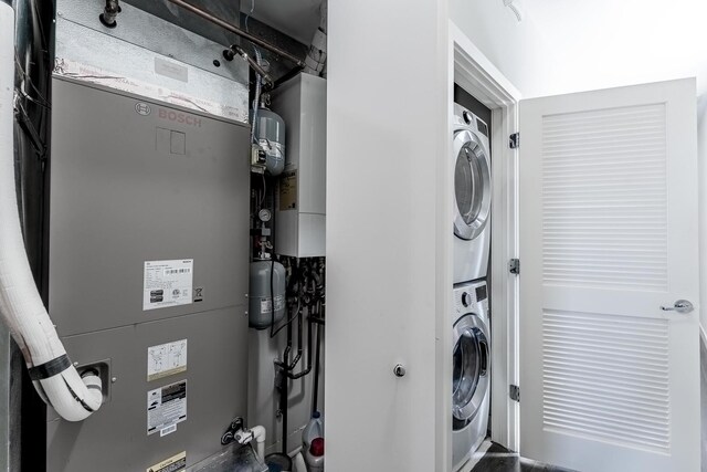 2143 W 19th St Unit 3, Chicago, IL 60608 - laundry room featuring stacked washer / drying machine and heating unit