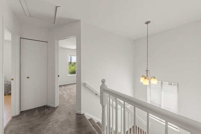 2812 Sun Valley Dr, Plainfield, IL 60586 - hallway featuring carpet floors, an upstairs landing, and a chandelier
