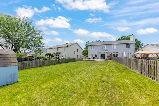 2812 Sun Valley Dr, Plainfield, IL 60586 - rear view of property with a fenced backyard, a gazebo, and a chimney