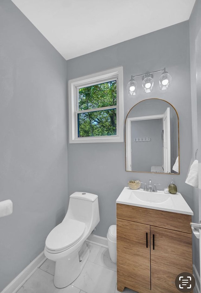7825 S St Lawrence Ave, Chicago, IL 60619 - bathroom with vanity and marble look tiles