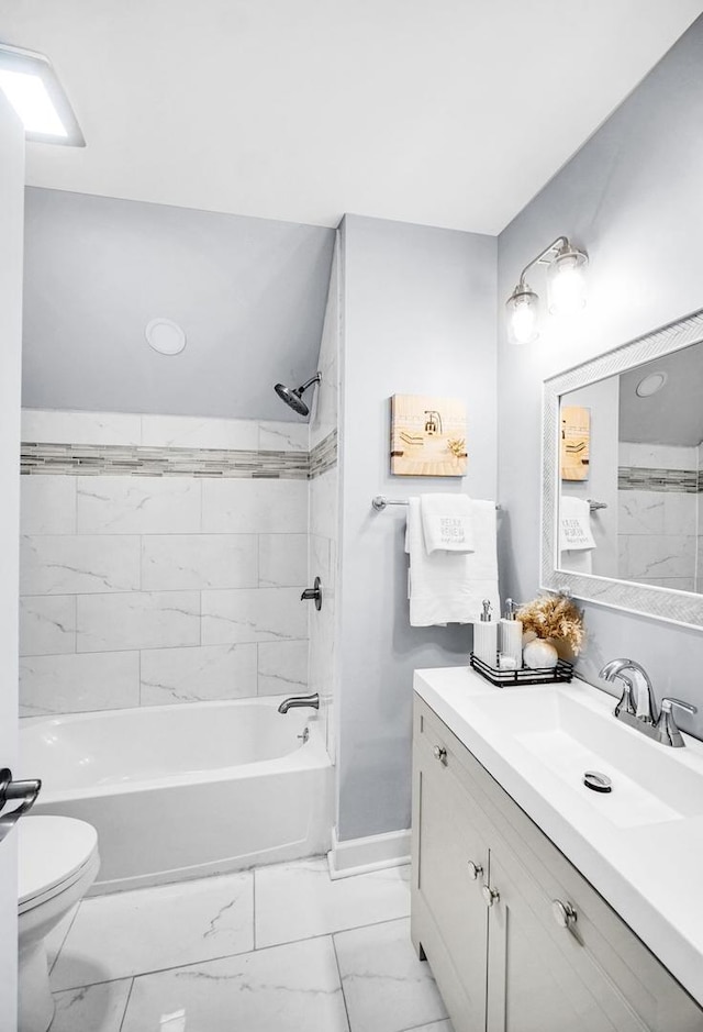 7825 S St Lawrence Ave, Chicago, IL 60619 - bathroom featuring vanity, marble look tiles, and bathing tub / shower combination