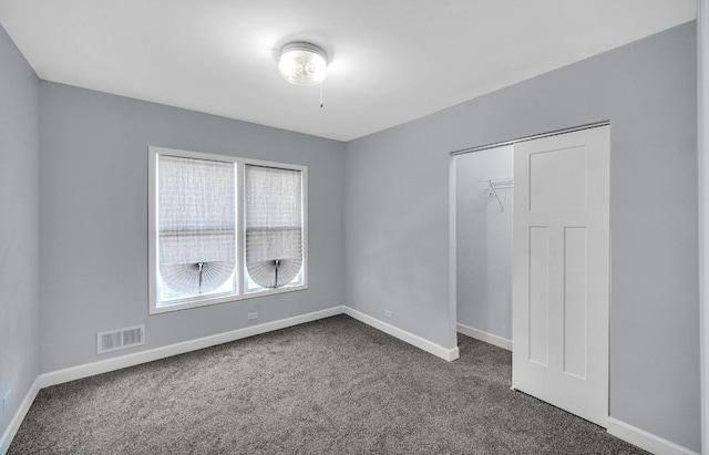 7825 S St Lawrence Ave, Chicago, IL 60619 - spare room with dark colored carpet