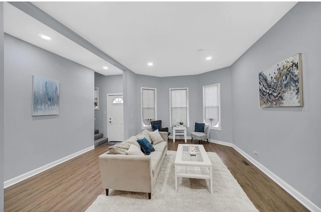 7825 S St Lawrence Ave, Chicago, IL 60619 - living room with wood finished floors, stairs, and recessed lighting