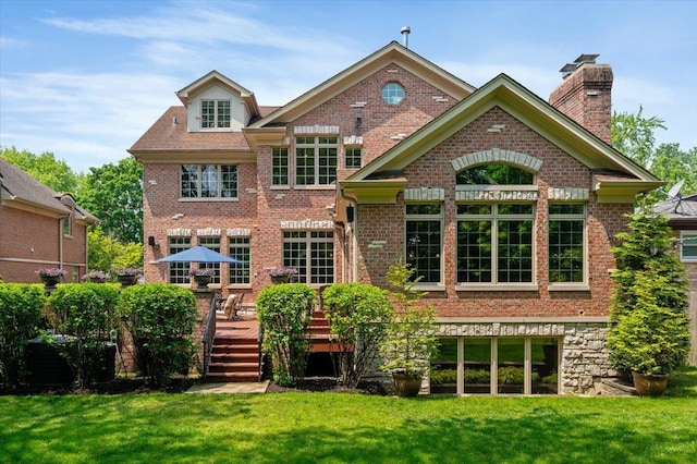 320 Vista Dr, Wilmette, IL 60091 - rear view of property with a wooden deck, a lawn, brick siding, and a chimney