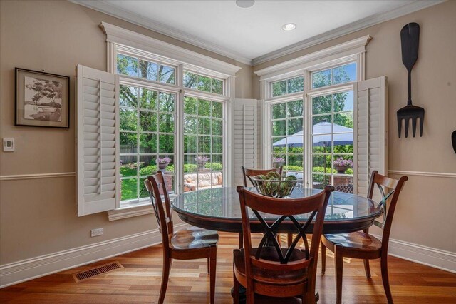 320 Vista Dr, Wilmette, IL 60091 - dining room featuring ornamental molding and wood finished floors